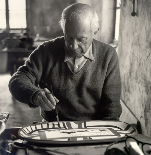 Picasso
                      painting a ceramic in 1953