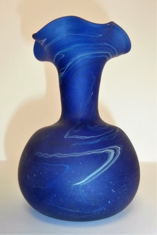 Fluted
                  round base extended neck vase