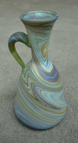 Bell shaped vase
                  with handle 5 3/4"