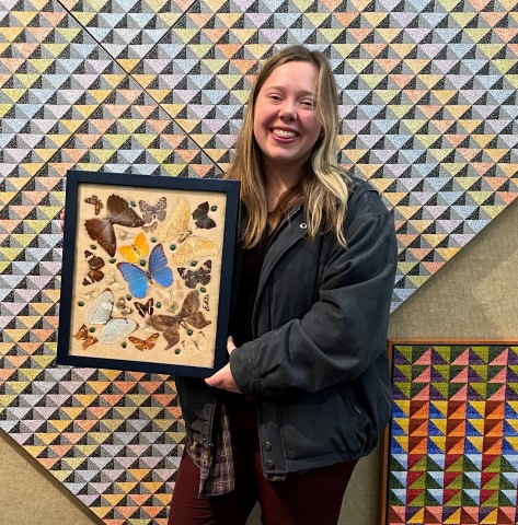 Jamie
                                and her framed butterflies