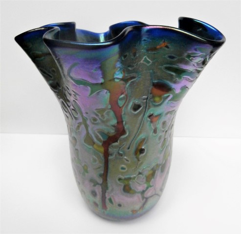 Wavy
                        blue iridescent multicolor vase